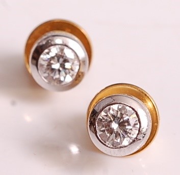Lot 1106 - A pair of 18ct yellow and white gold, diamond...