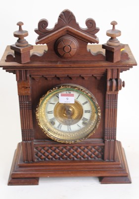 Lot 9 - An early 20th century carved walnut cased...