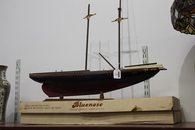 Lot 12 - A French 'bluenose' wooden model of a ship,...