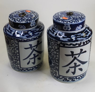 Lot 15 - A pair of table candlesticks, each in the form...