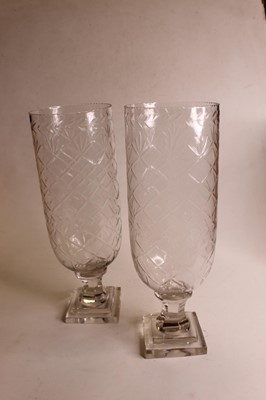 Lot 17 - A pair of modern cut glass storm lamps, each...