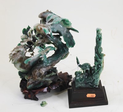 Lot 48 - A Japanese carved green hardstone model of...