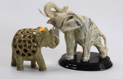Lot 239 - A 20th century resin figure of an elephant,...