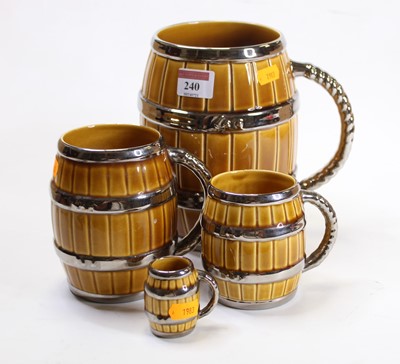 Lot 240 - A set of four Wade graduated tankards, each in...