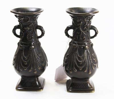 Lot 267 - A pair of bronze vases each having a flared...