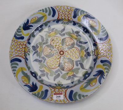 Lot 268 - An 18th century English Delft charger on a...