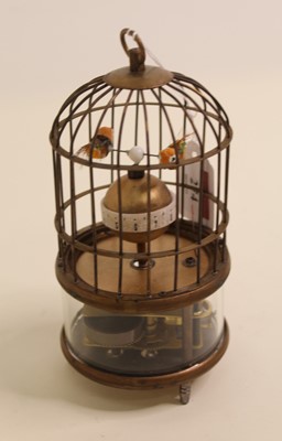 Lot 274 - A reproduction singing bird in cage clock...