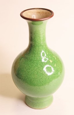 Lot 283 - A green crackle glazed vase having a flared...