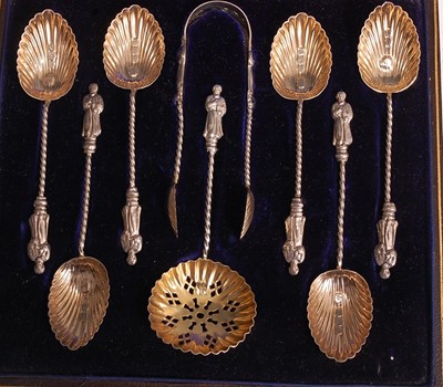Lot 1050 - A late Victorian cased silver-gilt eight-piece...