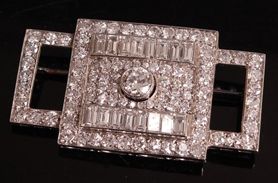 Lot 1108 - A white metal Art Deco diamond panel brooch,...