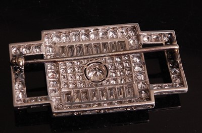 Lot 1108 - A white metal Art Deco diamond panel brooch,...