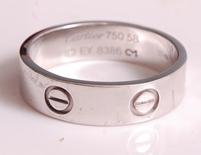 Lot 1109 - An 18ct white gold Cartier Love ring, width...