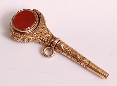 Lot 1154 - A yellow metal engraved swivel fob pendant...