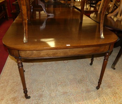 Lot 1404 - A George III mahogany double D-end dining...