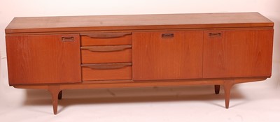 Lot 464 - A 1960s teak long sideboard by Greaves &...