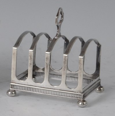 Lot 97 - An Art Deco silver four-division toast rack,...