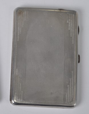 Lot 101 - An Art Deco silver engine turned pocket...