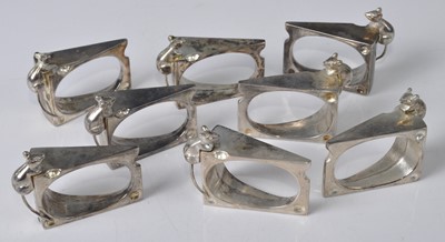 Lot 140 - A set of eight contemporary cast metal napkin...
