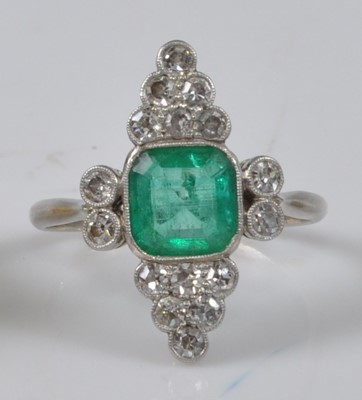 Lot 1148 - A white metal Art Deco emerald and diamond...