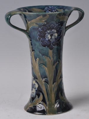 Lot 35 - A Moorcroft Late Florian design pottery twin...