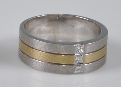 Lot 1149 - A yellow and white metal satin finish three...
