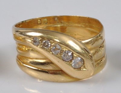 Lot 1147 - A late Victorian yellow metal snake ring, the...