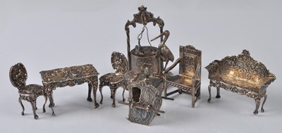 Lot 1069 - A collection of Edwardian silver dolls house...
