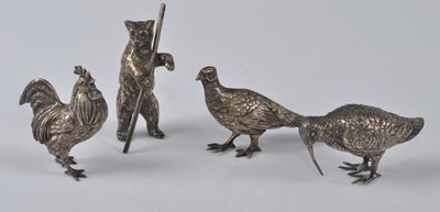 Lot 1070 - A collection of four various silver miniature...