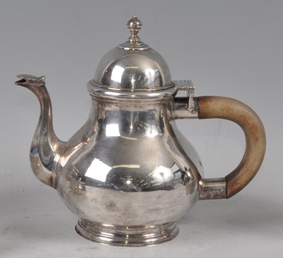 Lot 1082 - A George V Britannia silver teapot, the plain...