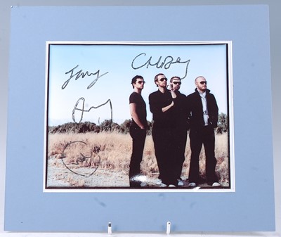 Lot 670 - Coldplay, a 20 x 25.5cm colour photograph of...