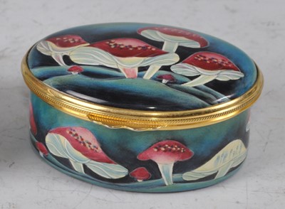 Lot 8 - A contemporary Moorcroft Enamels oval lidded...