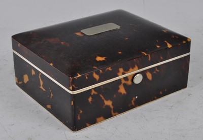 Lot 1203 - An Edwardian tortoiseshell table cigarette box...