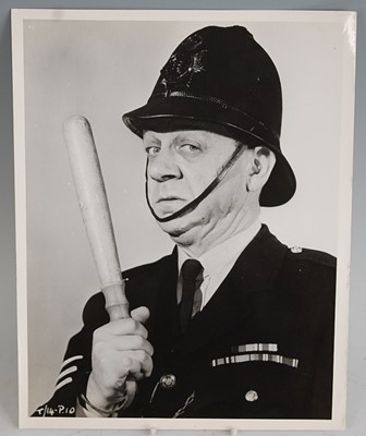 Lot 632 - A collection of press photographs and front of...
