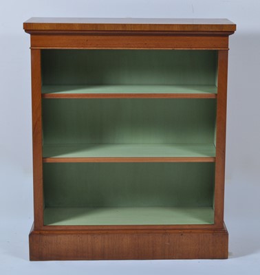 Lot 1362 - A walnut and figured walnut freestanding open...