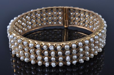 Lot 1115 - A yellow metal and cultured pearl set hinged...