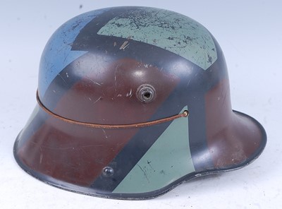Lot 7 - A German M16 stalhelm, having painted...