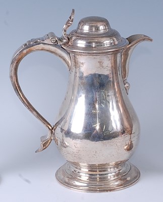 Lot 1062 - An early George III silver wine or beer jug,...