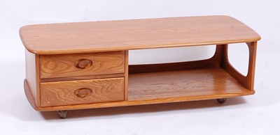Lot 503 - An Ercol light elm 'Pandora's Box' long coffee...