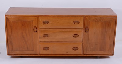 Lot 504 - An Ercol blond elm Windsor sideboard, the...