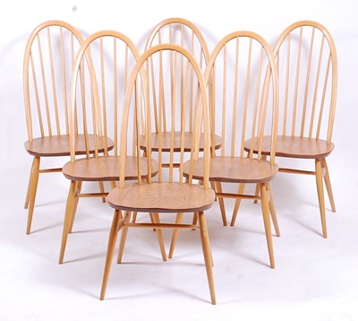 Lot 506 - A set of six Ercol light elm stickback dining...