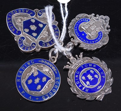 Lot 395 - Four various silver and enamel sporting medals,...
