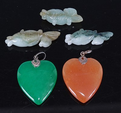 Lot 455 - A green hardstone carved heart pendant;...