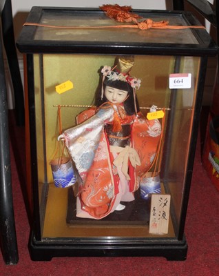 Lot 554 - A 20th century Japanese doll, in traditional...