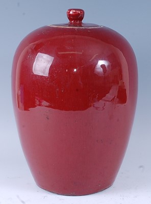 Lot 2453 - A Chinese sang-de-boeuf jar and cover, of...