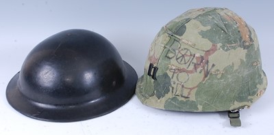 Lot 25 - A British ARP type helmet, having a leather...