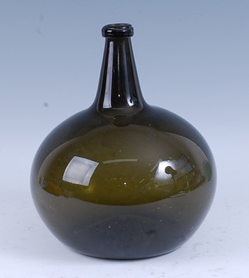 Lot 2241 - * An early 18th century brown glass wine...