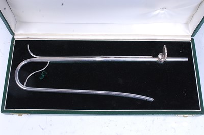 Lot 2281 - * A contemporary silver wine siphon, of...