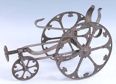 Lot 2228 - * An early 20th century brass alloy bottle...