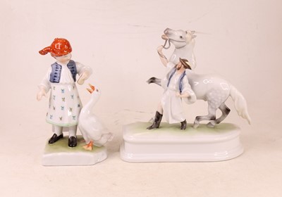 Lot 195 - A Herend porcelain figure modelled as a young...