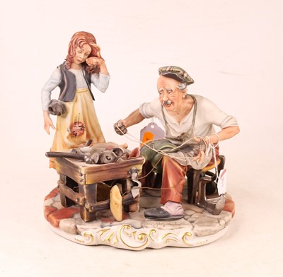 Lot 201 - A Capo di Monte figure group The Cobbler, with...